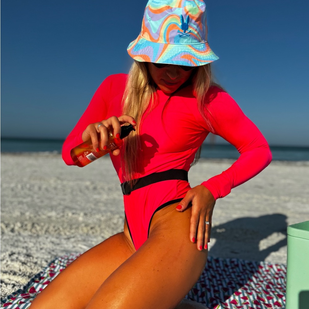 Pink and lime green body suits… great for water sport or like swimsuit